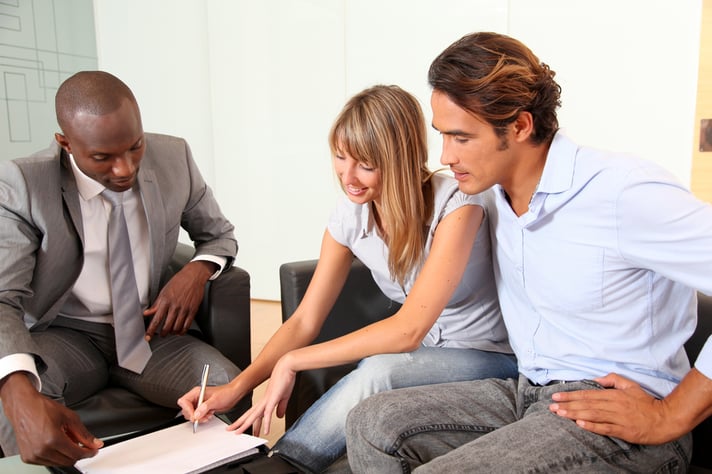 Couple signing home-purchase contract-2