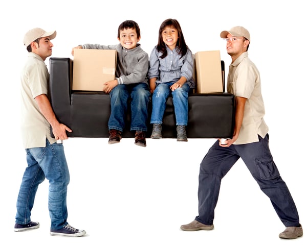 Delivery men carrying a heavy couch with kids - isolated over a white background