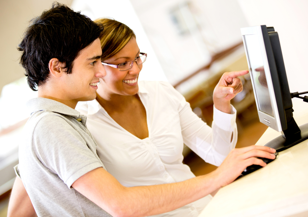 Students using a computer at the university